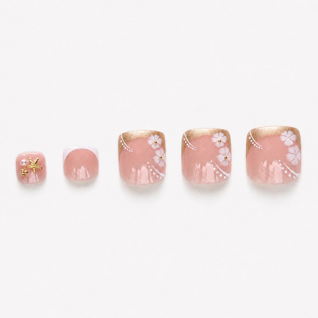 Faux ongles pour pieds press-on Plage Dorée avec French dorée, fleurs tropicales 3D, étoiles de mer et mini perles