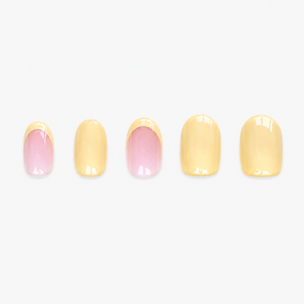 Faux ongles press-on courts Mimosa Soimea butter yellow avec French colorée et capsules unies en packshot