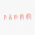Faux ongles press-on courts Pâquerette Soimea avec French butter yellow et fleurs 3D en packshot